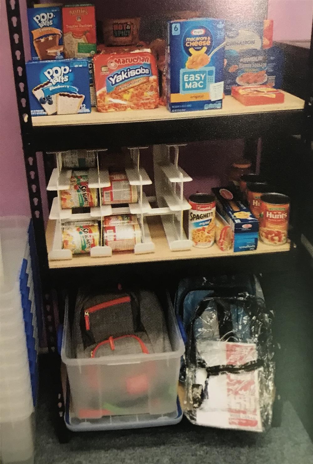 Caring Closet, showing shelves stacked with food items. Caring Closet, showing shelves stacked with food items.